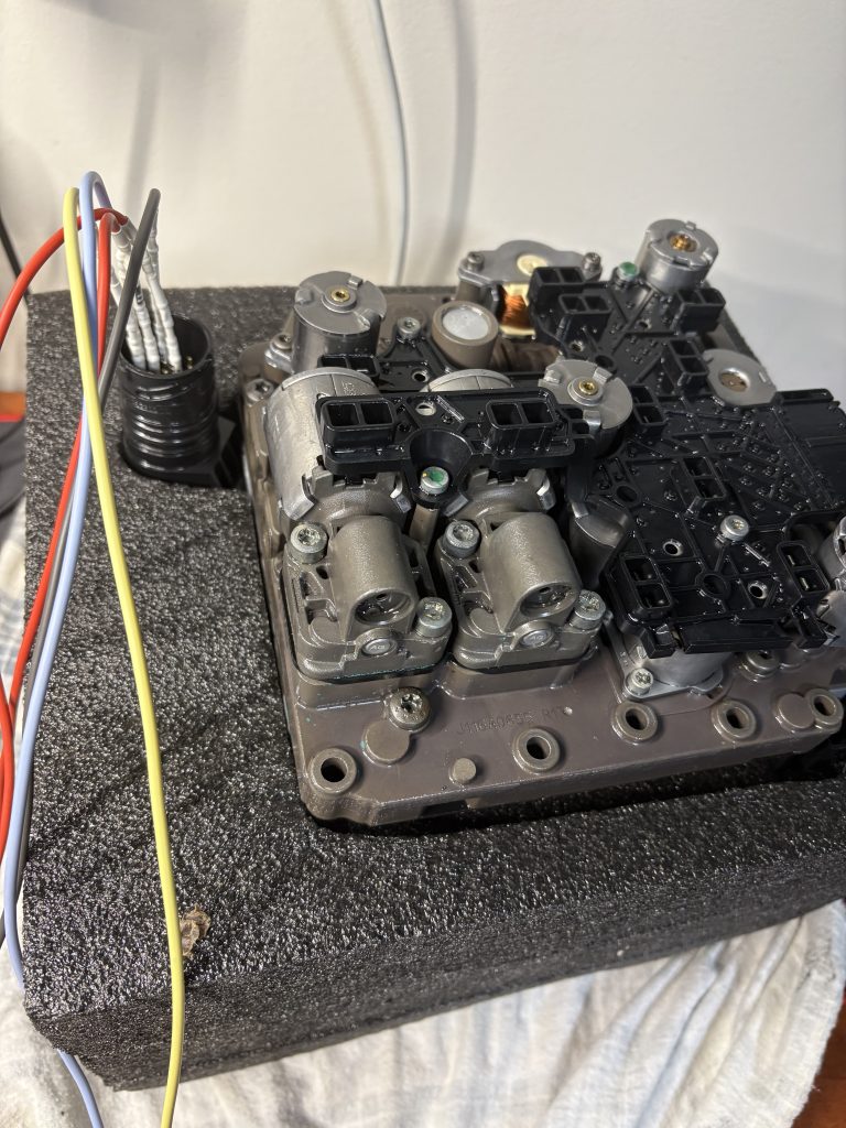 DQ250 DSG mechatronic 02E927770AQ on bench — Vancouver Key Rescue, Surrey BC